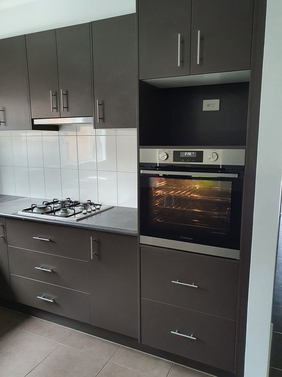 New kitchen with a wall oven, gas cooktop and a power point in the appliance cavity