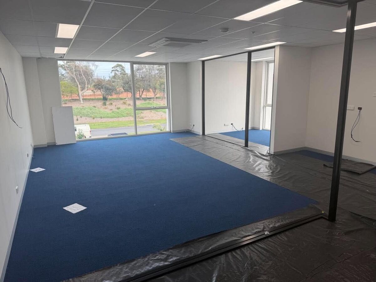 Office fit-out with new carpet, floor boxes and glass partitions
