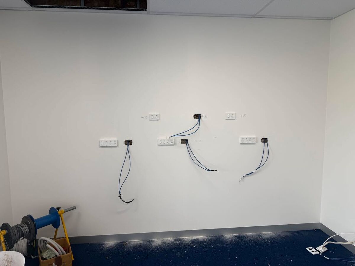 Office wall with new power and data points ready to fit off